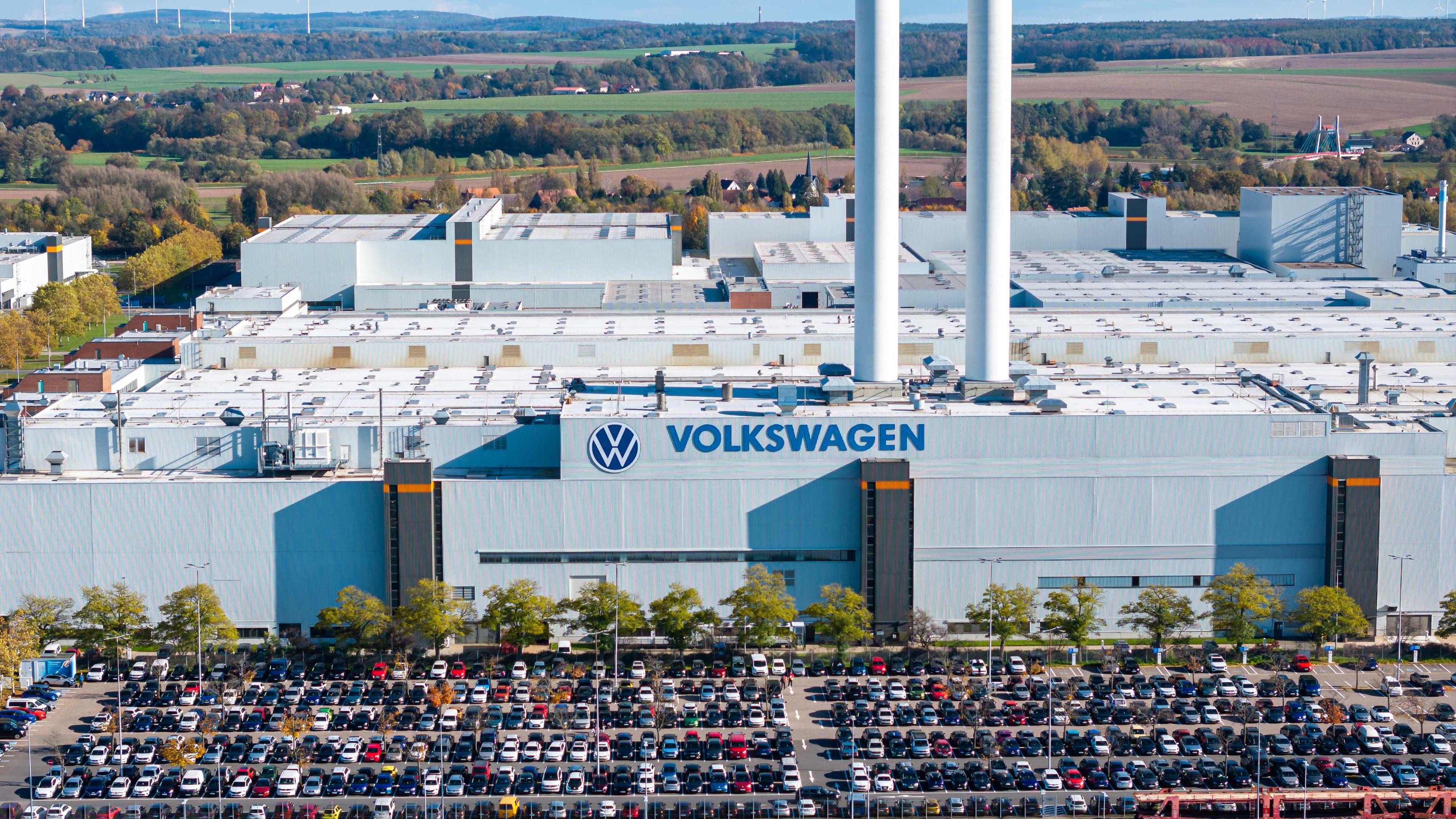 Aerial view taken on October 28, 2024 shows the plant of German car maker Volkswagen (VW) in Zwickau, eastern Germany. Ailing auto giant Volkswagen plans to close at least three factories in Germany and slash tens of thousands of jobs as part of drastic cost-savings drive, workers' representatives said on October 28, 2024, calling the proposed cuts "of historic dimensions". The plan laid out by management, which affects the namesake VW brand, also includes a 10-percent pay cut for all staff, the company's powerful works council said in an update to staff.