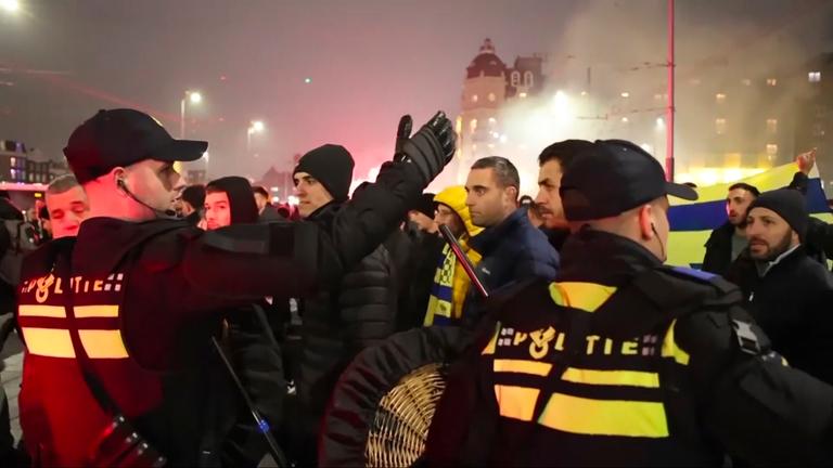 n this image taken from video, police escort Maccabi Tel Aviv supporters to the metro station leading them to the Ajax stadium, after pro-Palestinian supporters marched near the stadium, in Amsterdam, the Netherlands