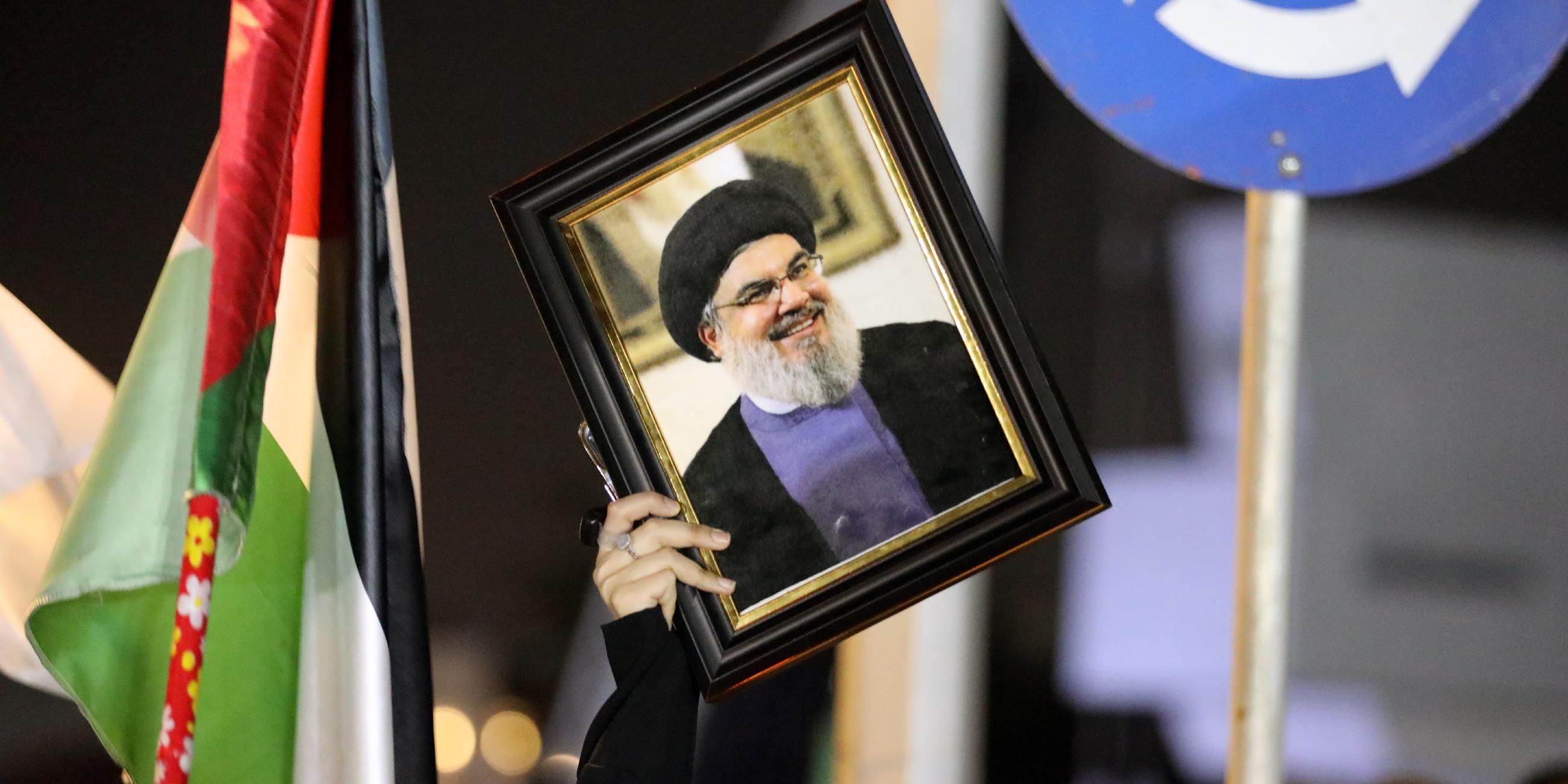Supporters of Hezbollah Brigades protest against the killing of Nasrallah, in central Baghdad