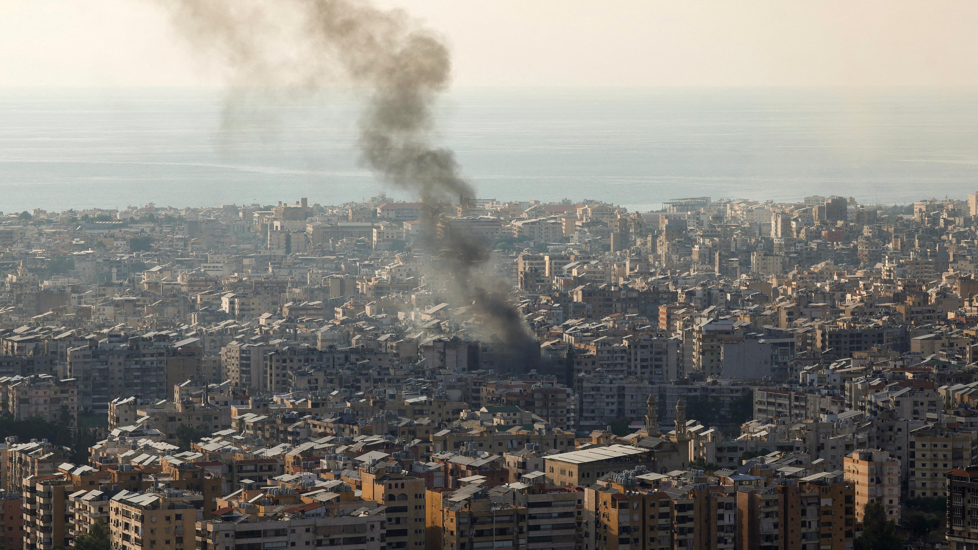 Smoke rises over Beirut's southern suburbs from a generator that caught fire, according to residents, as seen from Baabda, Beirut, Lebanon