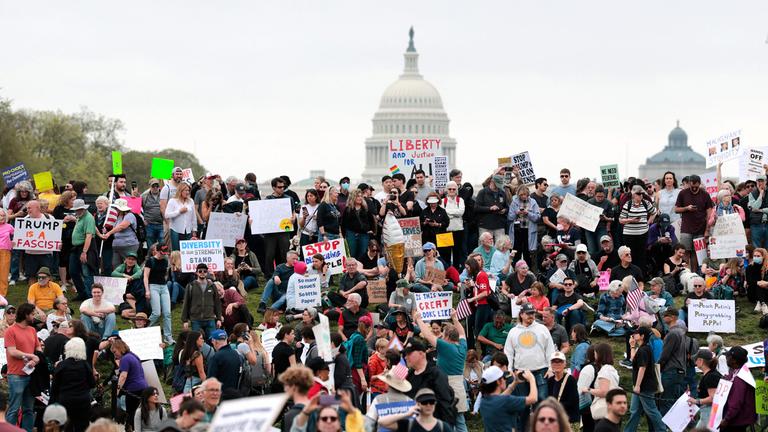 Protesters attend a "Hands Off" rally to demonstrate against U.S. President Donald Trump on the National Mall on April 5, 2025 in Washington, DC.