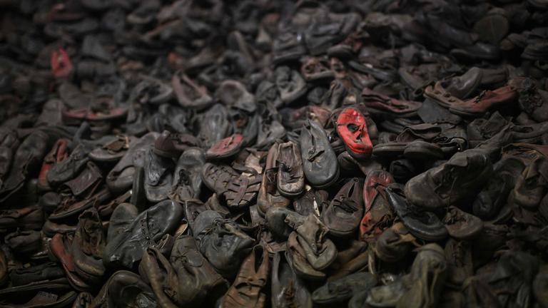 Shoes at the Auschwitz museum are pictured on the sidelines of commemorations on the 80th anniversary of the liberation of the German Nazi concentration and extermination camp Auschwitz-Birkenau by the Red Army, in Oswiecim, Poland on January 27, 2025. (Photo by Victoria JONES / POOL / AFP)