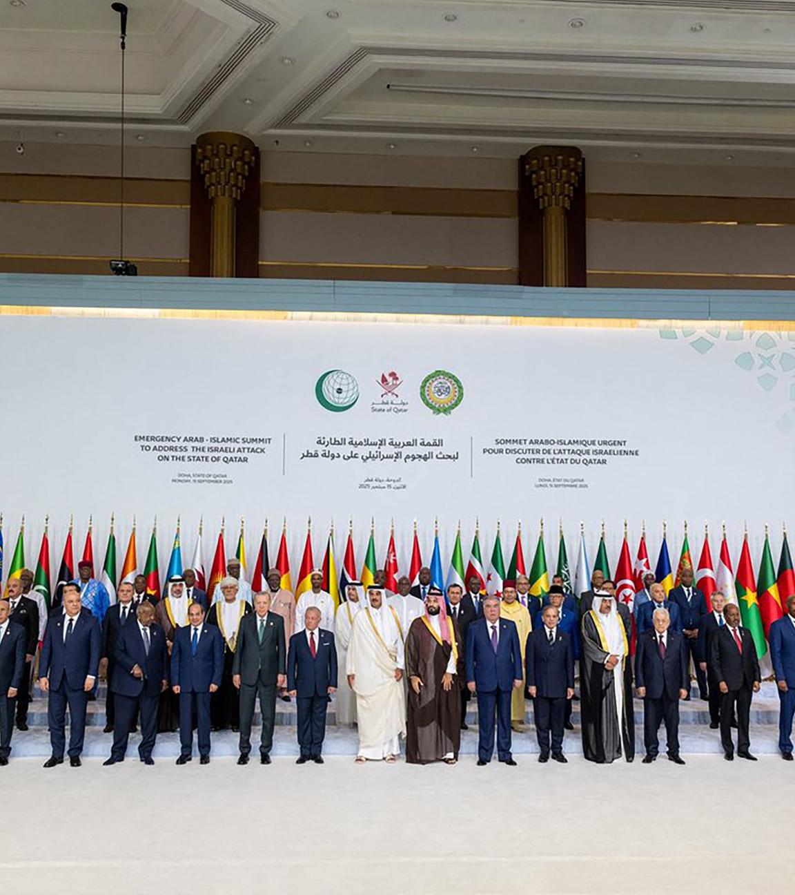 This handout picture released by the he Qatar News Agency (QNA) shows Qatar's Emir Sheikh Tamim bin Hamad Al-Thani (C) posing for a group picture with leaders, heads of state and other officials during the 2025 Arab-Islamic emergency summit in Doha on September 15, 2025