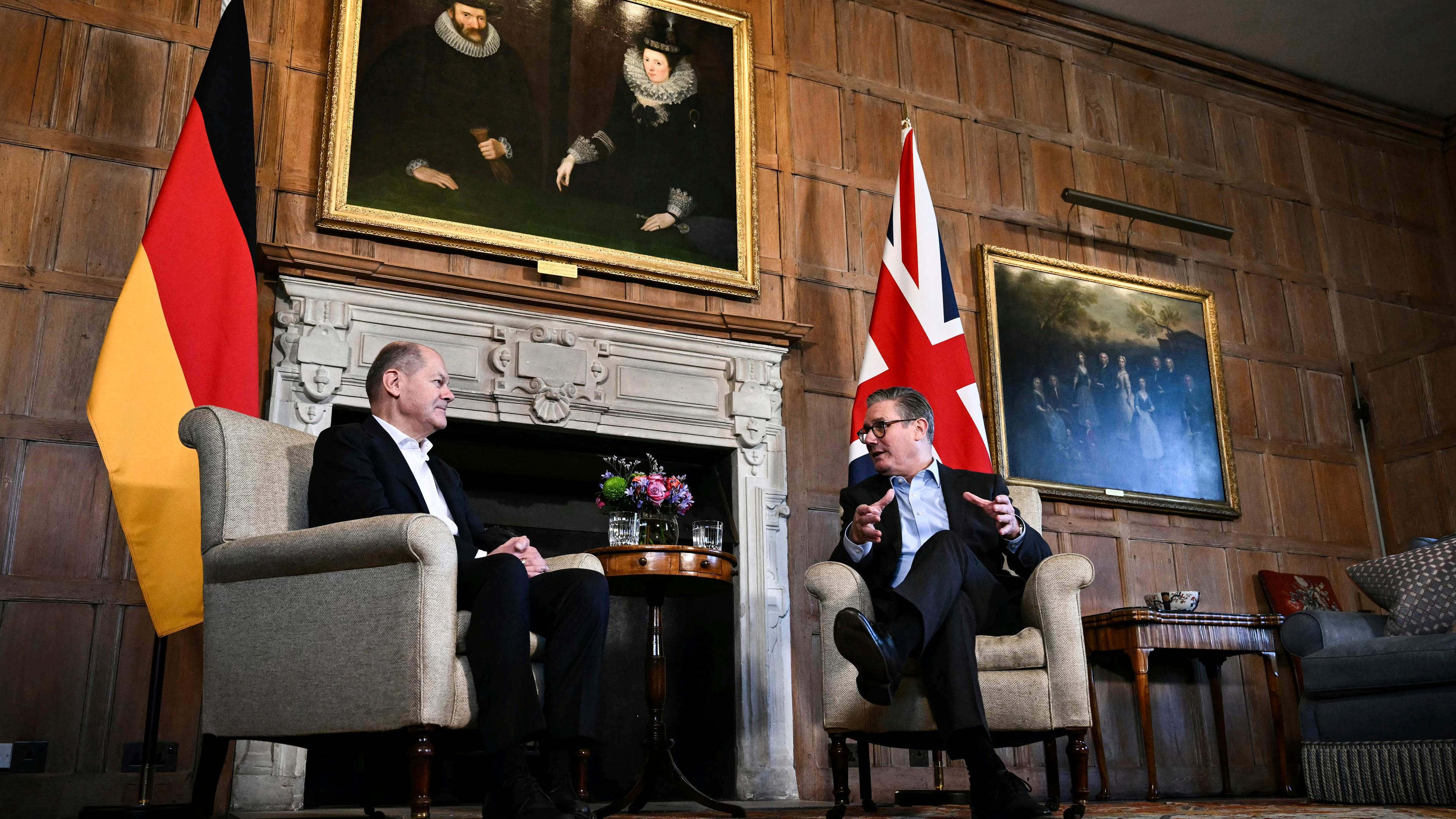 Britain's Prime Minister Keir Starmer, right, speaks with Germany's Chancellor Olaf Scholz during their bilateral meeting at the Chequers, in Aylesbury, England, Sunday, Feb. 2, 2025.