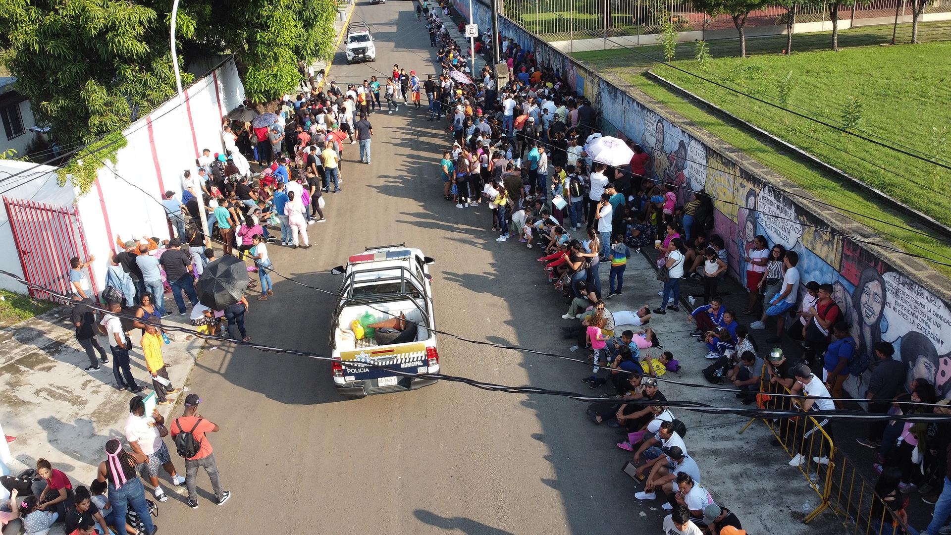 Migrants wait at Mexico's southern border after Trump's new migration measures