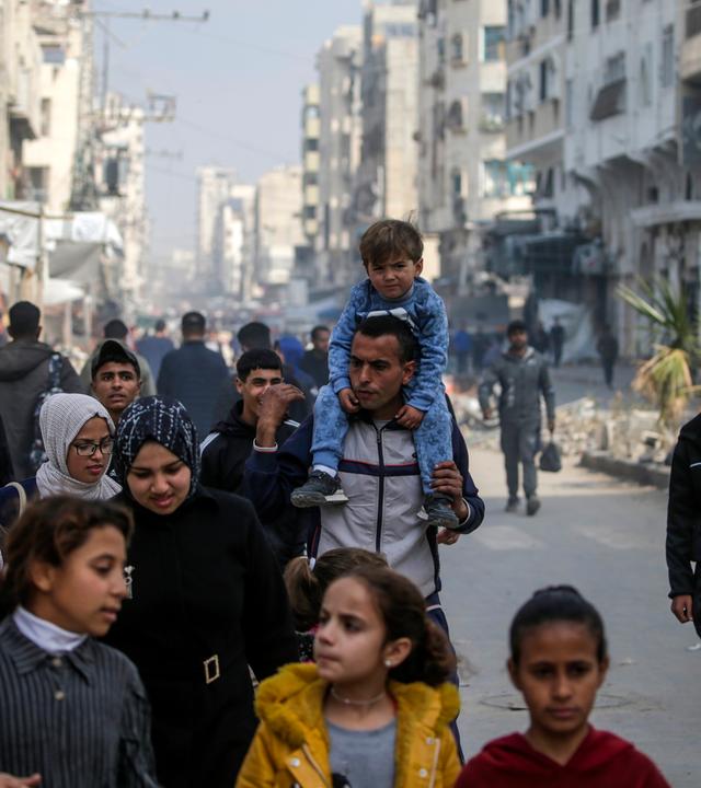  Palestinians walk in the streets of Gaza City amid a ceasefire between Israel and Hamas, Gaza Strip, 28 January 2025. Israel and Hamas implemented the first phase of a hostage release and ceasefire deal on 19 January 2025. More than 46,000 Palestinians have been killed in the Gaza Strip, according to the Palestinian Ministry of Health, since Israel launched a military campaign in the strip in response to a cross-border attack led by the Palestinian militant group Hamas on 07 October 2023, in which about 1,200 Israelis were killed and more than 250 taken hostage