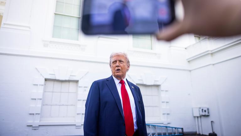 US President Donald Trump makes suprise appearance outside White House