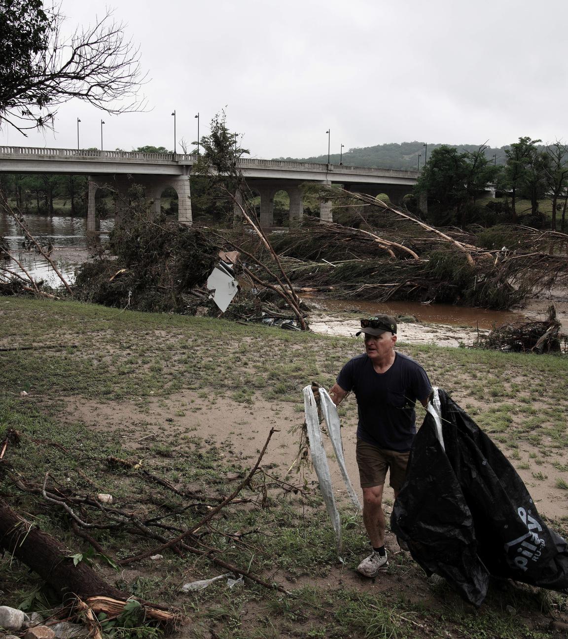Brian Niederhaus removes debris from his mothers riverfront property in Kerrville, Texas, USA 05 July 2025. Twenty seven people are confirmed dead and dozens missing after floodwaters swept through a summer camp and nearby homes early 04 July. Search and Rescue teams continue working around the clock following flash flooding on the Guadalupe River in Kerr County.