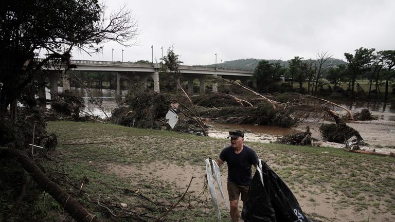 Brian Niederhaus removes debris from his mothers riverfront property in Kerrville, Texas, USA 05 July 2025. Twenty seven people are confirmed dead and dozens missing after floodwaters swept through a summer camp and nearby homes early 04 July. Search and Rescue teams continue working around the clock following flash flooding on the Guadalupe River in Kerr County.