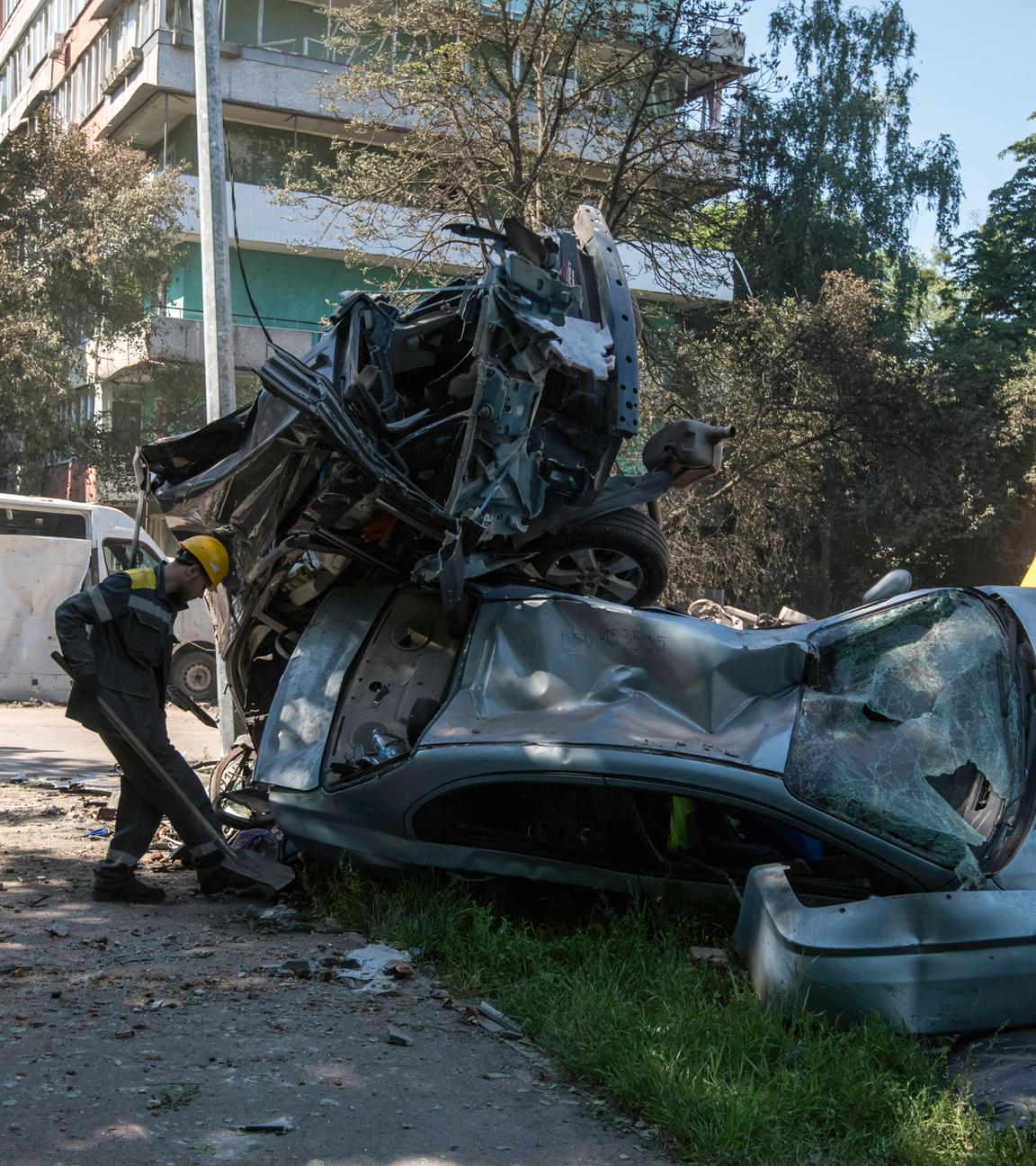 The Aftermath Of One Of The Most Massive Attacks On Kyiv Since The Start Of The Full-scale War Municipal workers clean up near burned-out vehicles at the site of Shahed drone strikes on a residential area of Kyiv, Ukraine, on July 4, 2025, after one of the most massive attacks on the city since the start of the full-scale war. Russia launches 539 drones and 11 missiles, mostly ballistic, at Ukraine during the night of July 3 to 4, 2025