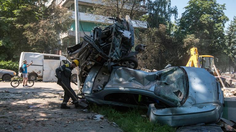 The Aftermath Of One Of The Most Massive Attacks On Kyiv Since The Start Of The Full-scale War Municipal workers clean up near burned-out vehicles at the site of Shahed drone strikes on a residential area of Kyiv, Ukraine, on July 4, 2025, after one of the most massive attacks on the city since the start of the full-scale war. Russia launches 539 drones and 11 missiles, mostly ballistic, at Ukraine during the night of July 3 to 4, 2025