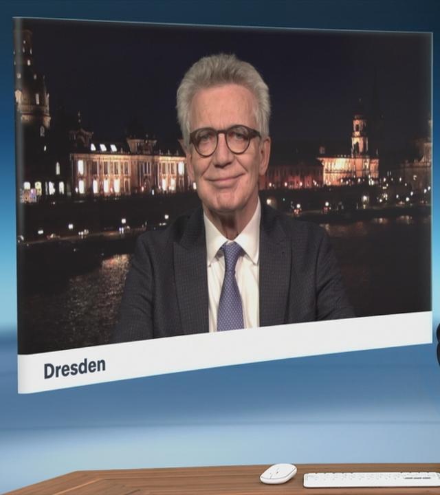 Christian Sievers und homas de Maizière (CDU) sprechen im Schaltgespräch miteinander