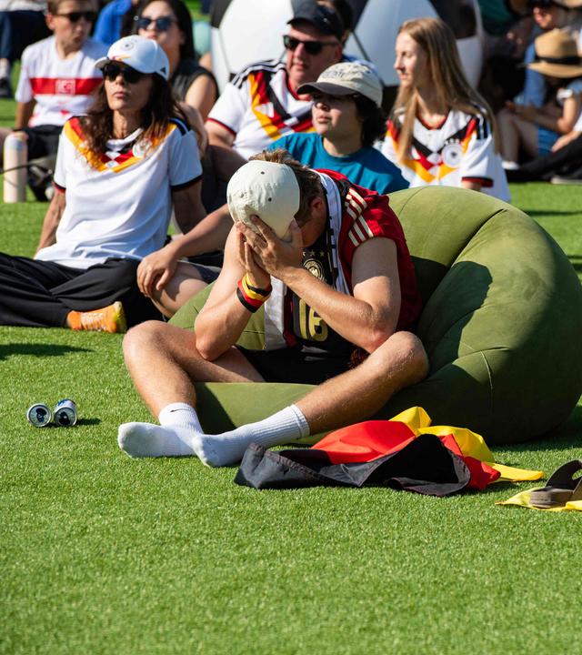 A German fan reacts to Paraguay scoring a goal at a watch party for the World Cup match between Germany and Paraguay in Boston, Massachusetts, on June 29, 2026
