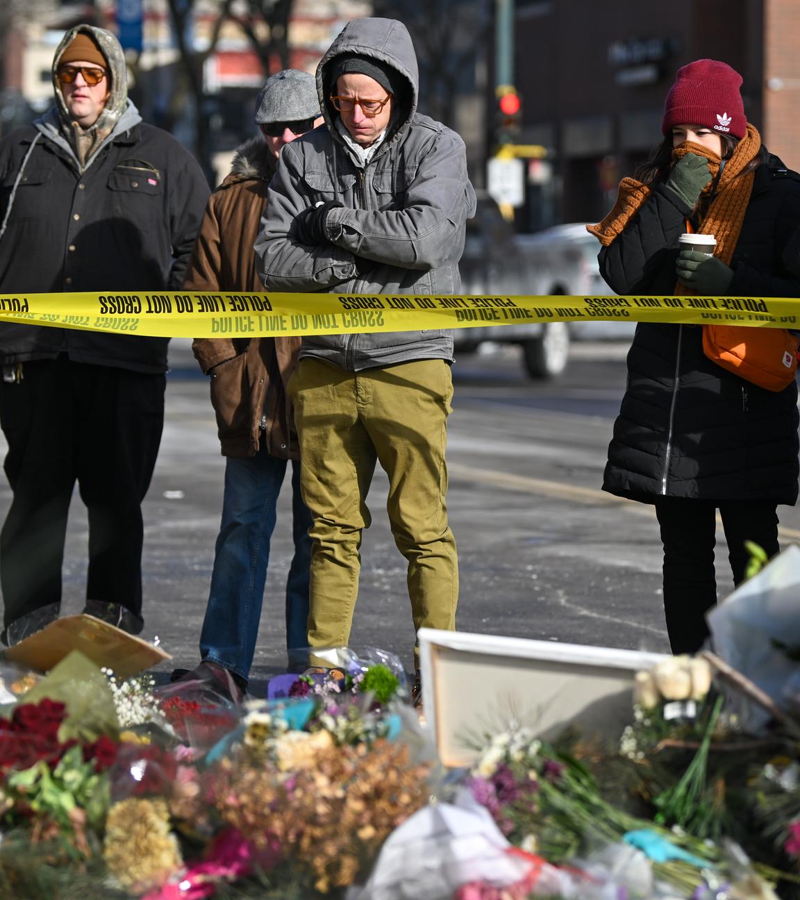 People take a moment at the memorial where Alex Pretti was fatally shot by federal agents in south Minneapolis, Minnesota, USA, 26 January 2026. Pretti is the second person killed by federal officers in Minneapolis this month.