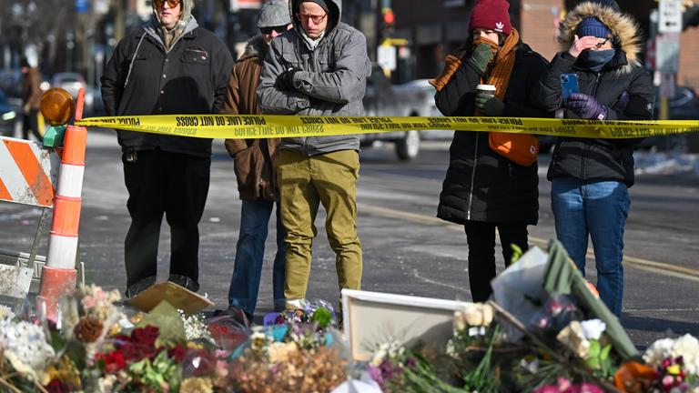 People take a moment at the memorial where Alex Pretti was fatally shot by federal agents in south Minneapolis, Minnesota, USA, 26 January 2026. Pretti is the second person killed by federal officers in Minneapolis this month.