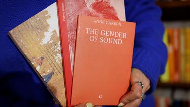 A shopkeeper holds books written by Canadian poet and essayist Anne Carson at a bookshop in central London, Britain, 08 October 2026
