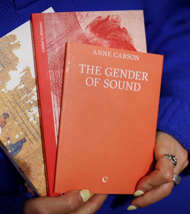 A shopkeeper holds books written by Canadian poet and essayist Anne Carson at a bookshop in central London, Britain, 08 October 2026