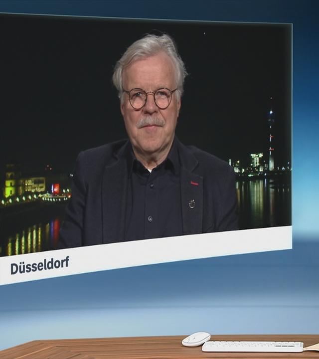 Schaltgespräch zwischen dem Moderator Christian Sievers und dem Astronauten und Physiker Reinhold Ewald  