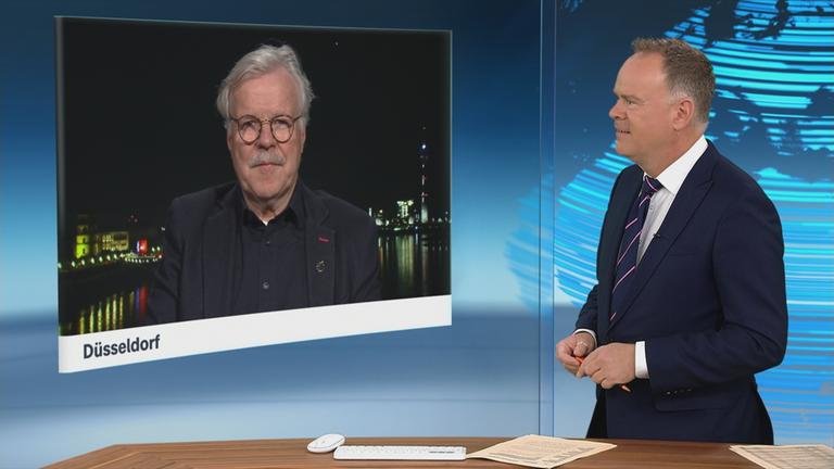 Schaltgespräch zwischen dem Moderator Christian Sievers und dem Astronauten und Physiker Reinhold Ewald  