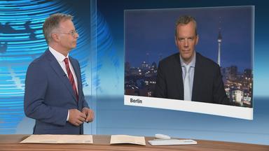 Schaltgespräch zwischen dem Moderator Heinz Wolf und dem Wirtschaftsexperten Florian Neuhann