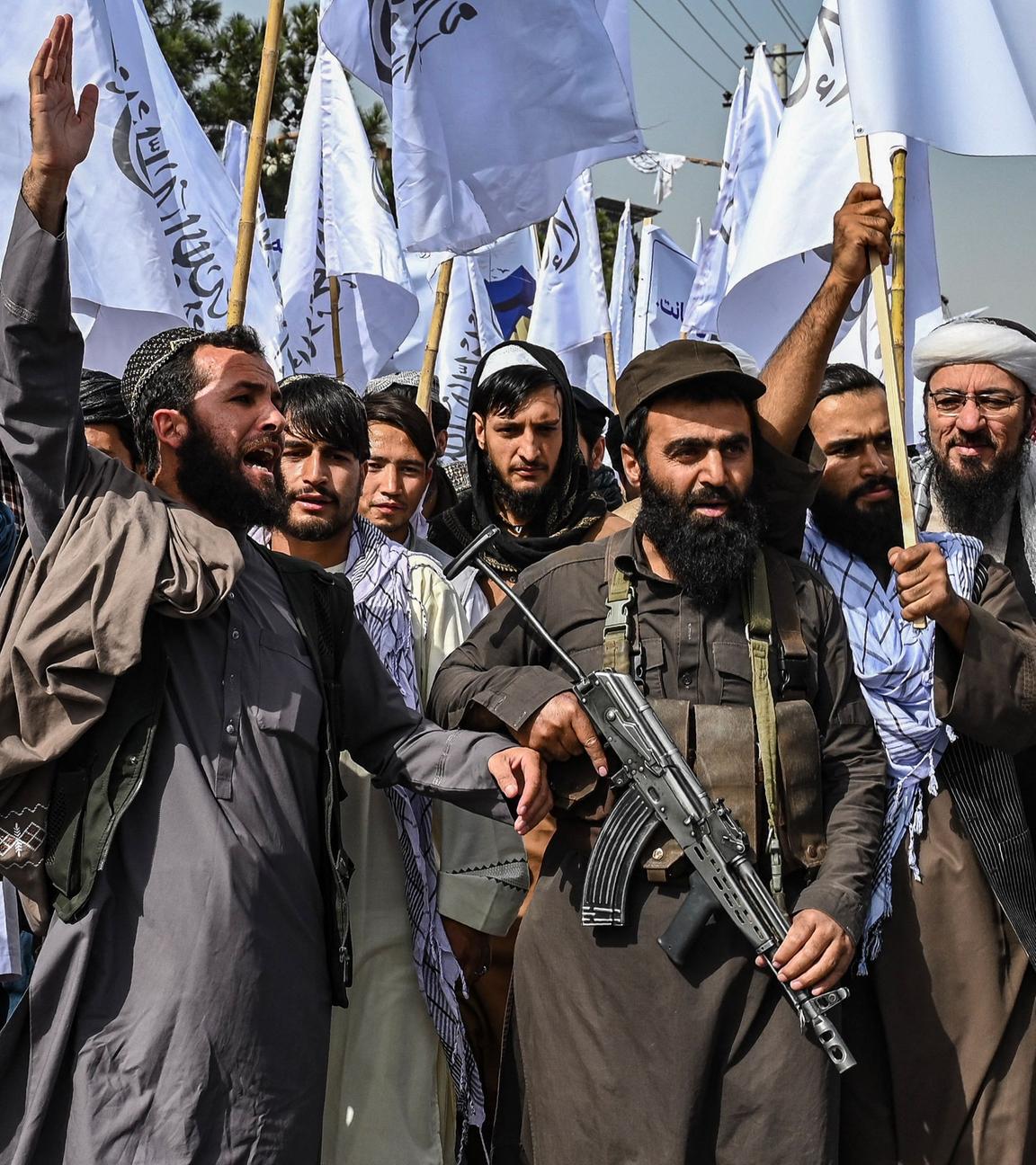 Taliban personnel shout slogans as they celebrate the fourth anniversary of their takeover of Afghanistan near the Kabul Polytechnic University in Kabul on August 15, 2025.