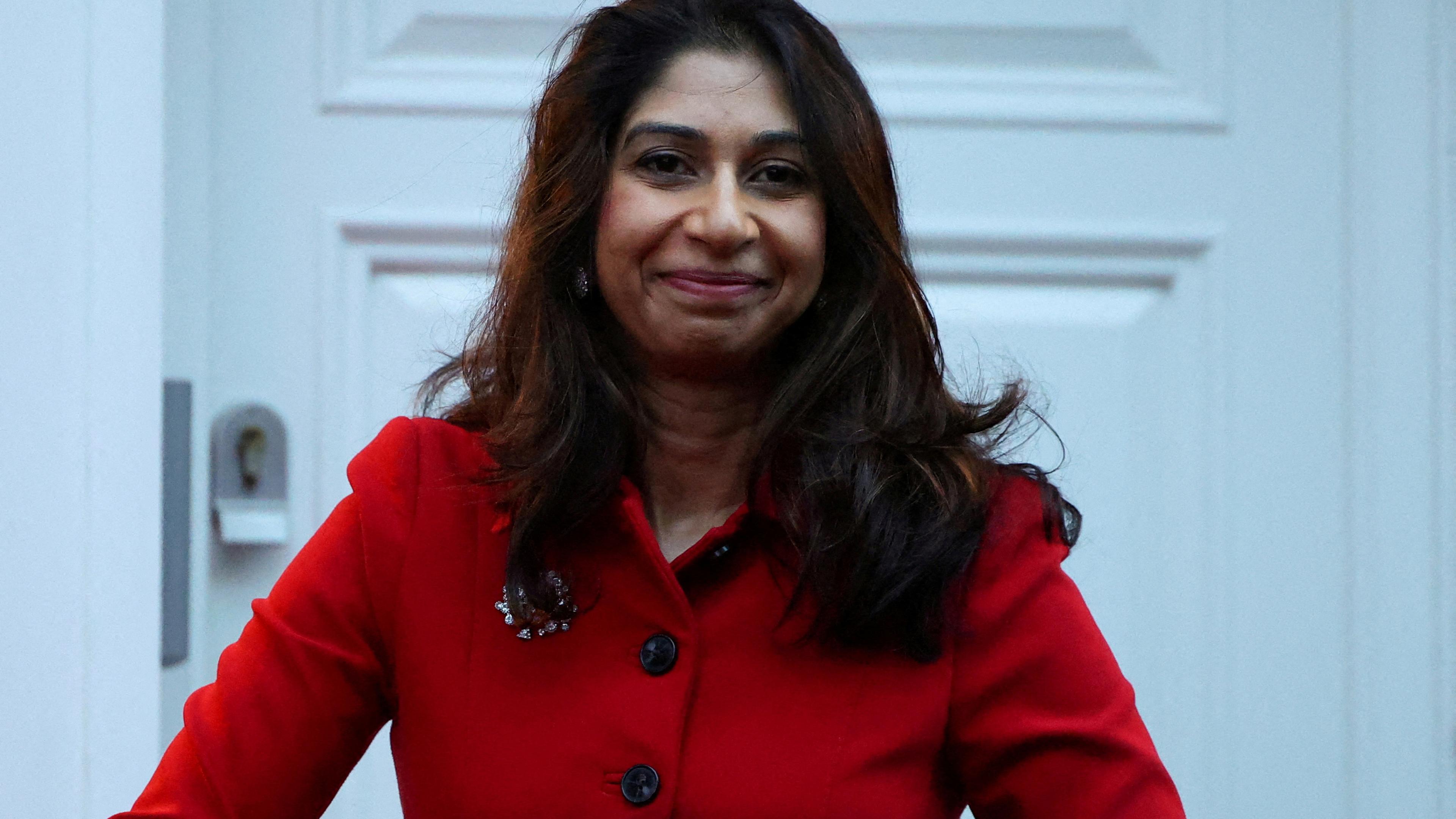 Britain's Home Secretary Suella Braverman walks outside her home, in London