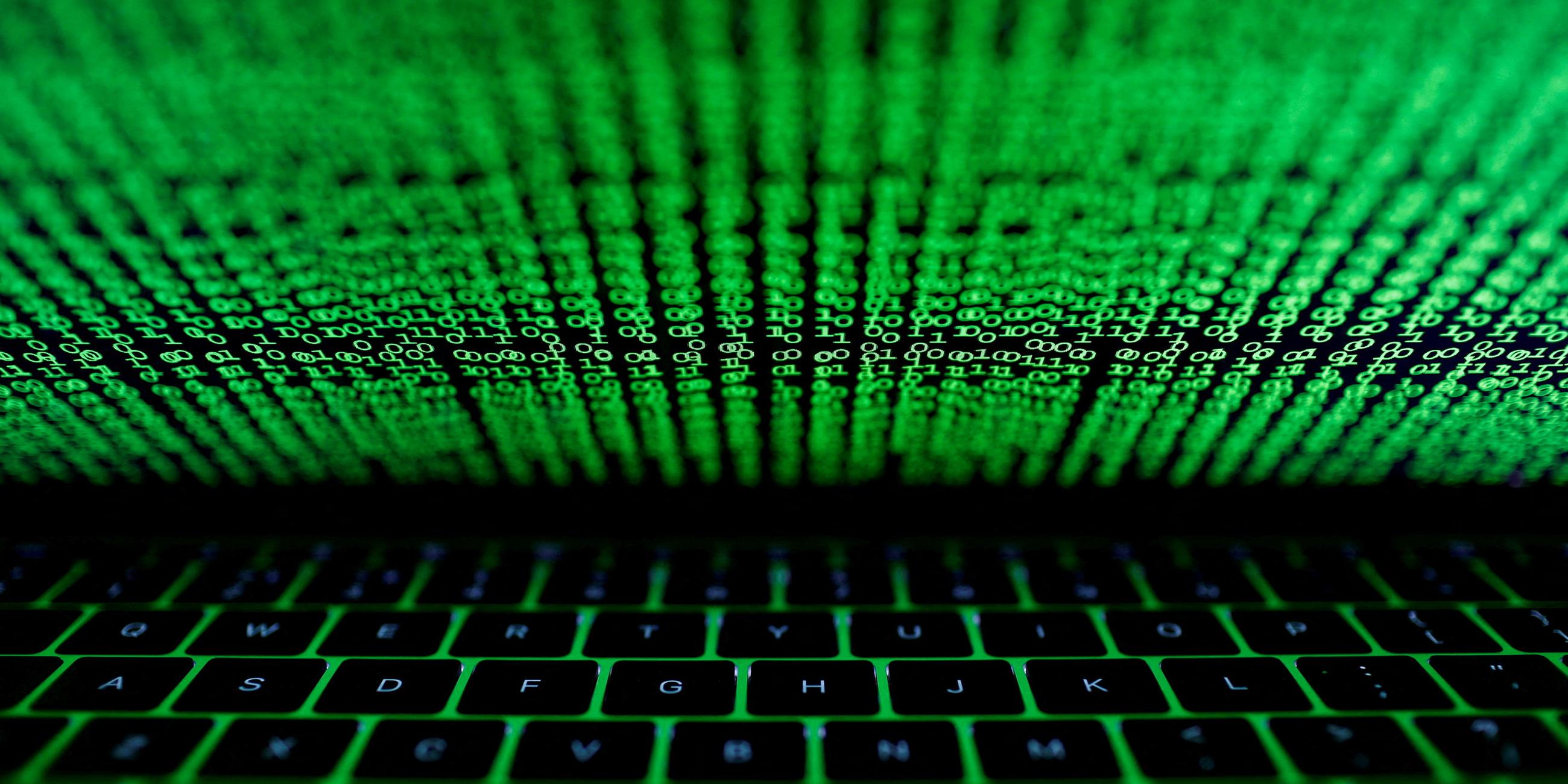 FILE PHOTO: A computer keyboard lit by a displayed cyber code is seen in this illustration picture