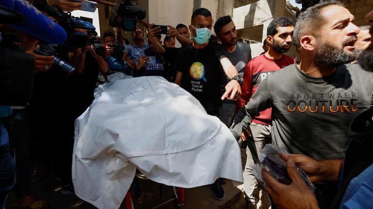 Bodies of foreign WCK workers killed in an Israeli strike are transported to their families outside Gaza, in Rafah, southern Gaz