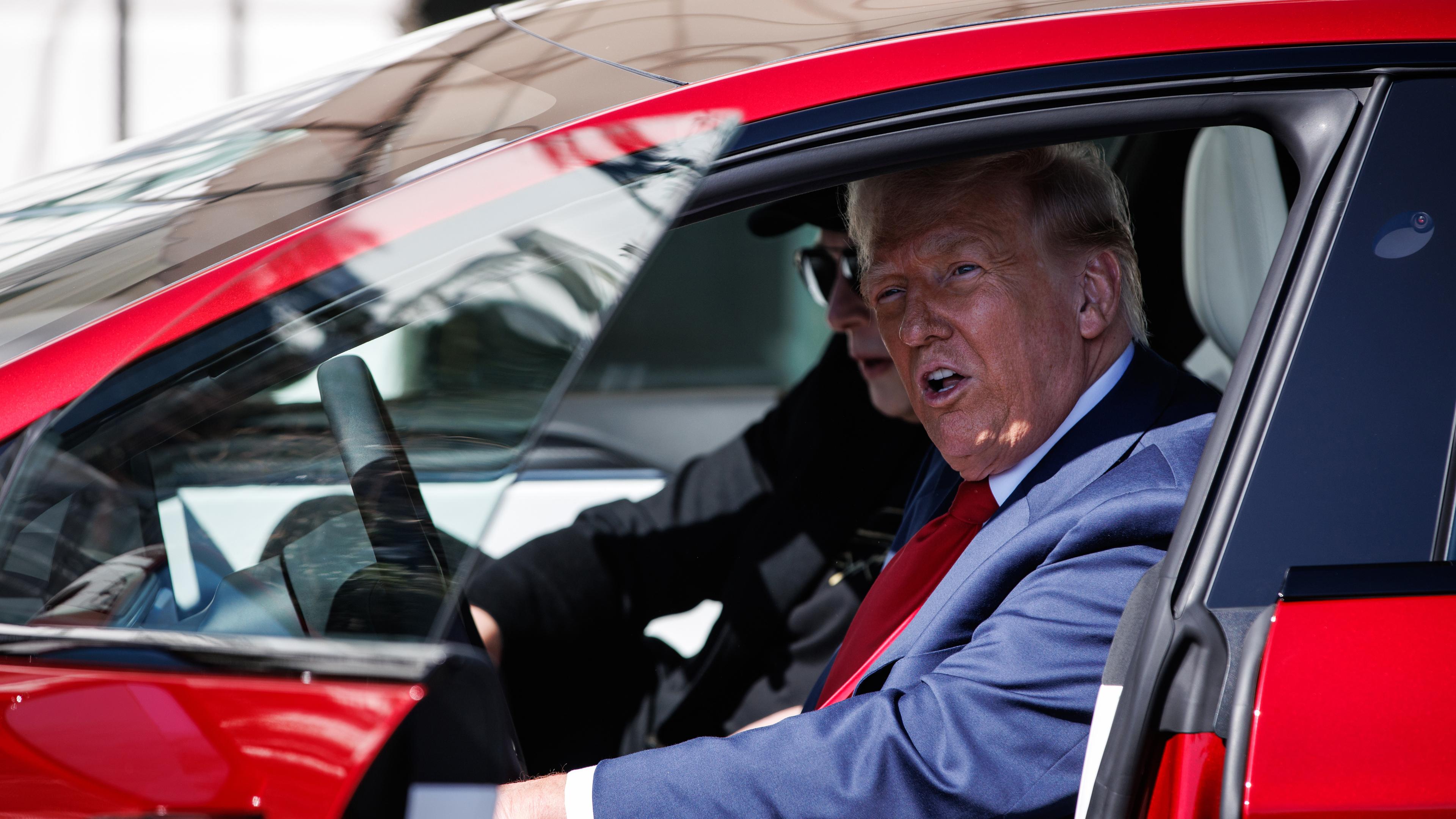 Trump uses White House as backdrop to boost Tesla sales