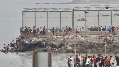 Thousands of migrants enter Spanish enclaves in North Africa