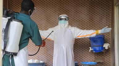 Photos show Congos fight against Ebola as cases surpass 10,000