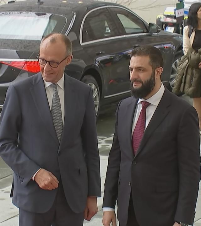 Friedrich Merz und Ahmed al-Scharaa