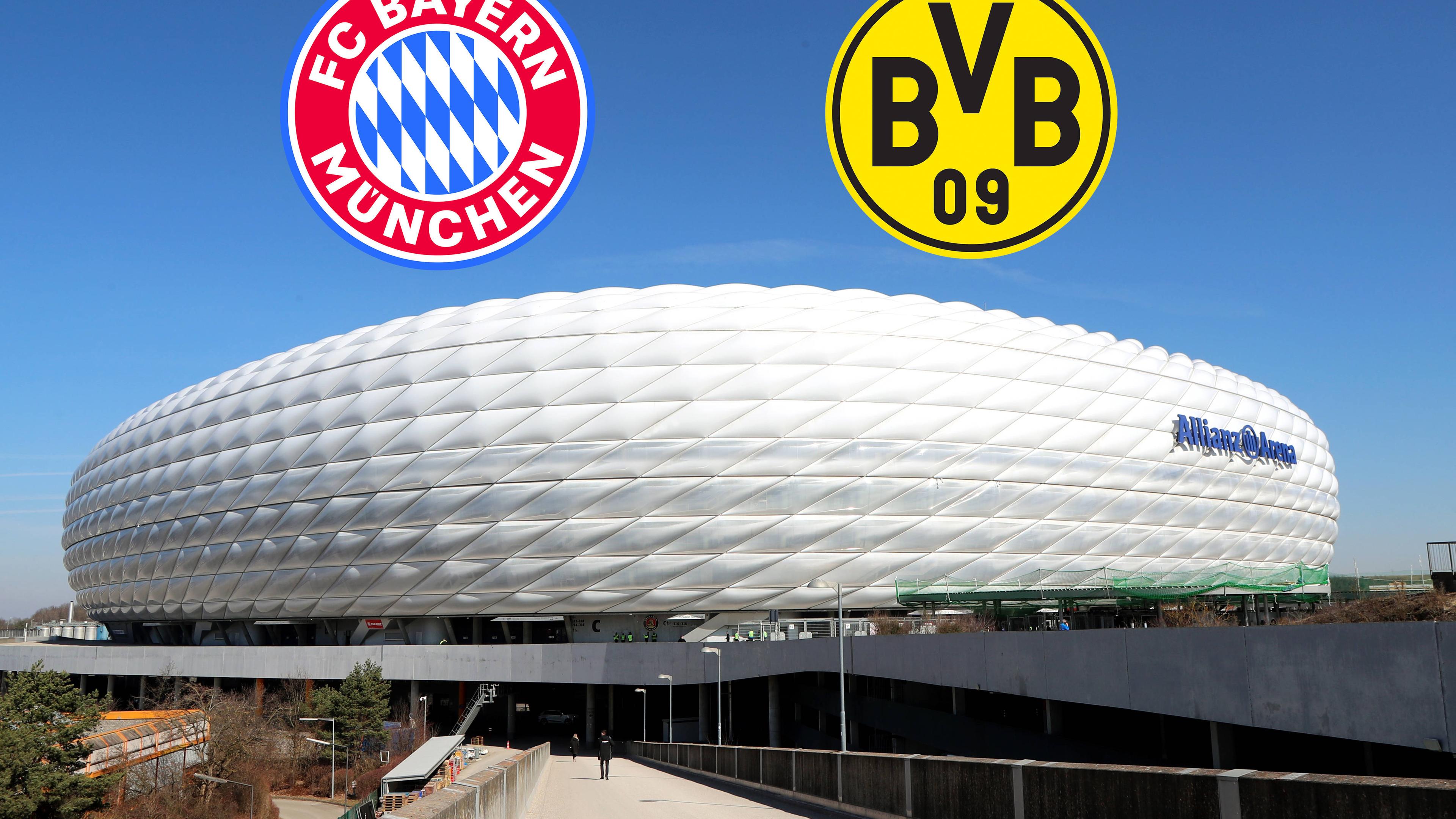 Die beiden Logos vom FC Bayern München und Borussia Dortmund über der Allianzarena 