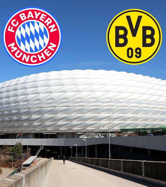 Die beiden Logos vom FC Bayern München und Borussia Dortmund über der Allianzarena 
