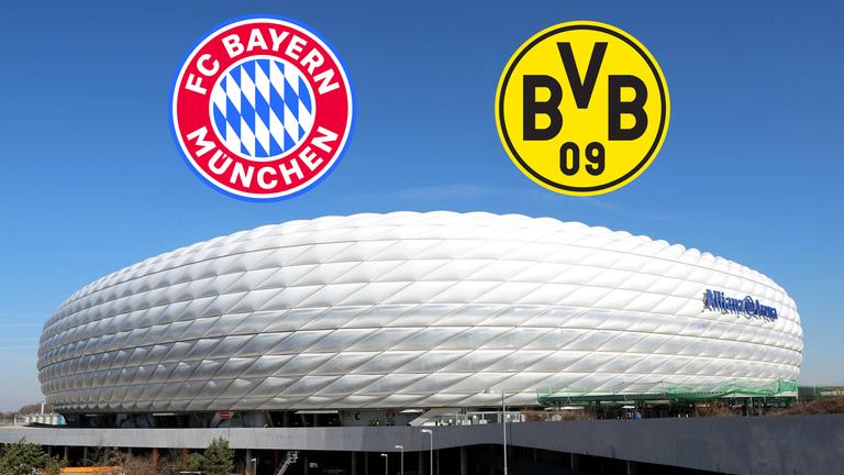 Die beiden Logos vom FC Bayern München und Borussia Dortmund über der Allianzarena 