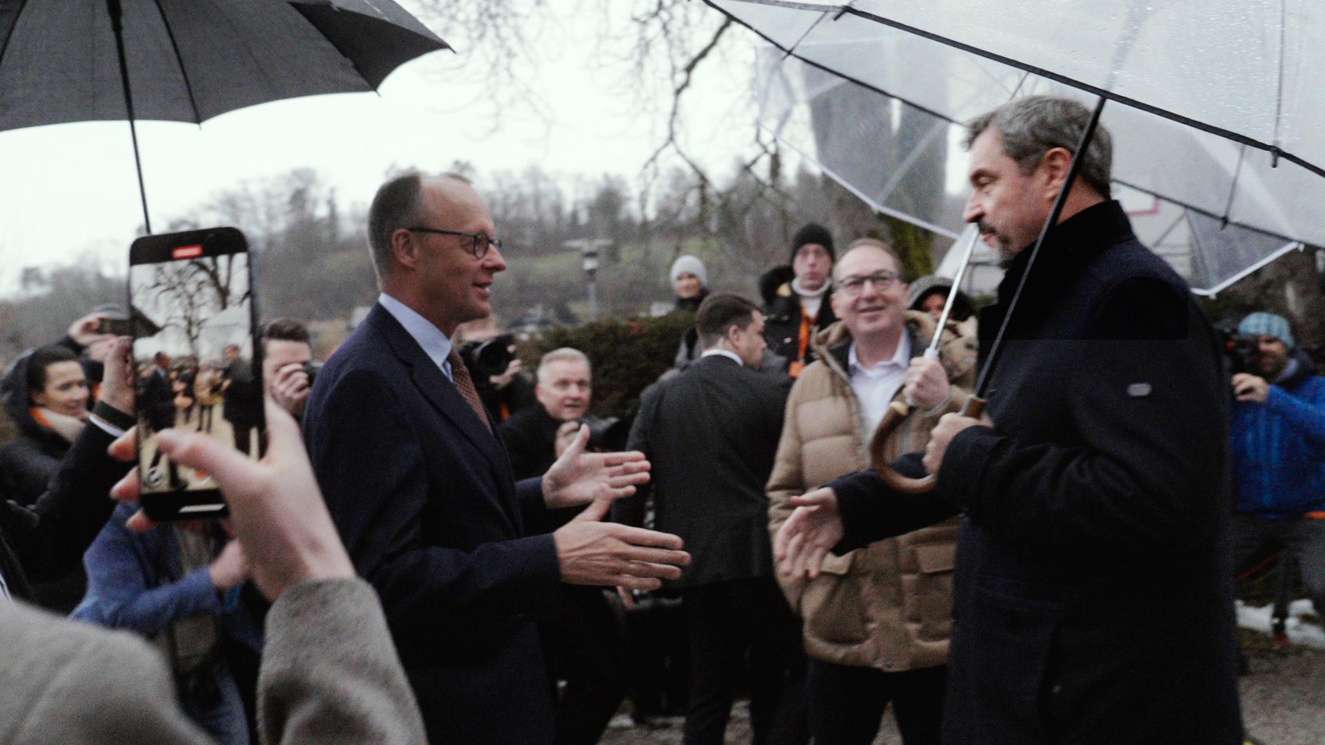 Friedrich Merz und Markus Söder in Menschenmenge