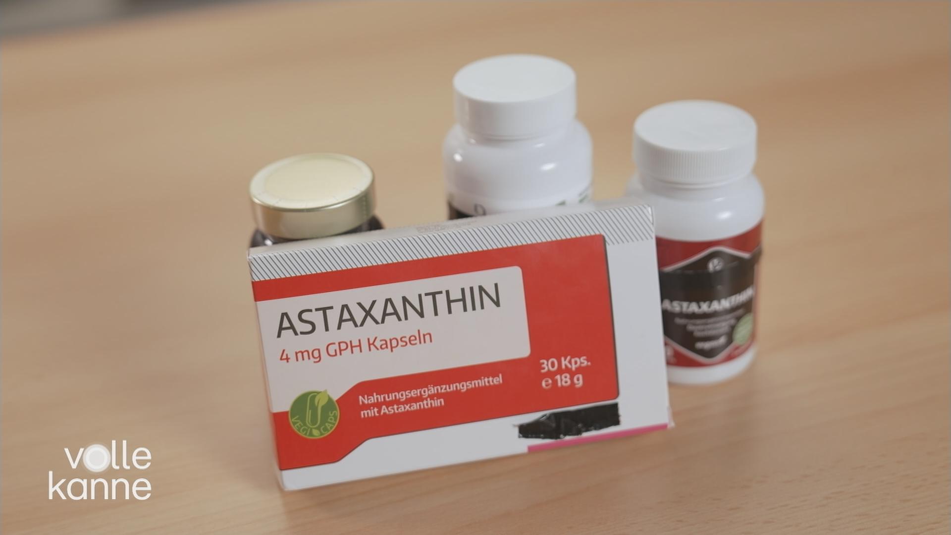 Eine Schachtel Astaxanthin vor anderen Dosen.