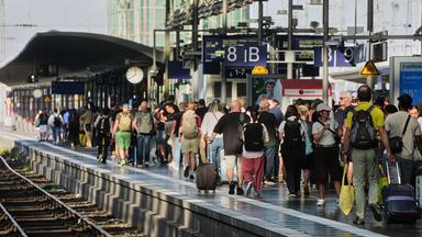 Passengers wait for a train at a platform in the central train station in Frankfurt, Germany, Wednesday, June 24, 2026, following the nationwide service disruption on the Deutsche Bahn network.