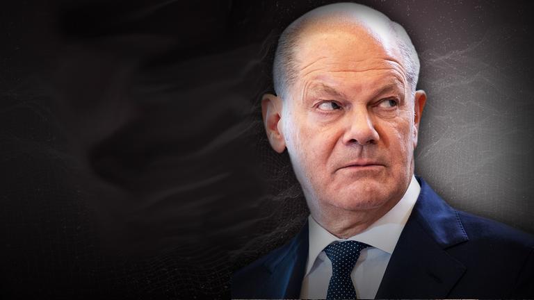Kanzler Olaf Scholz vor schwarzem Hintergrund