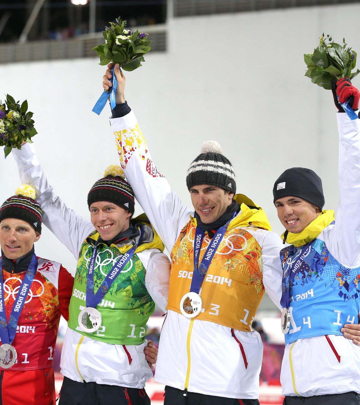 Die deutsche Biathlon-Staffel auf dem Podest während der olympischen Winterspiele 2014