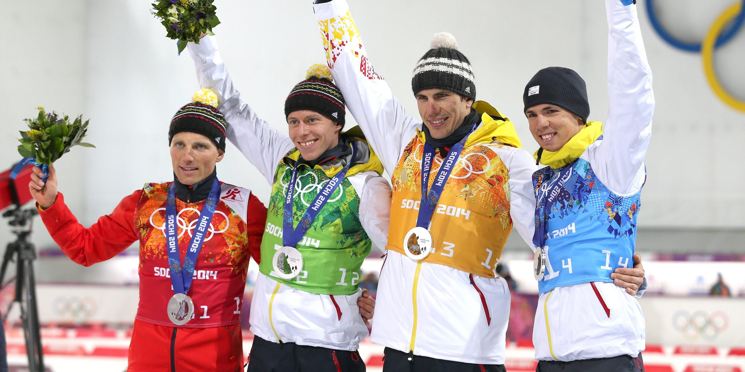 Die deutsche Biathlon-Staffel auf dem Podest während der olympischen Winterspiele 2014