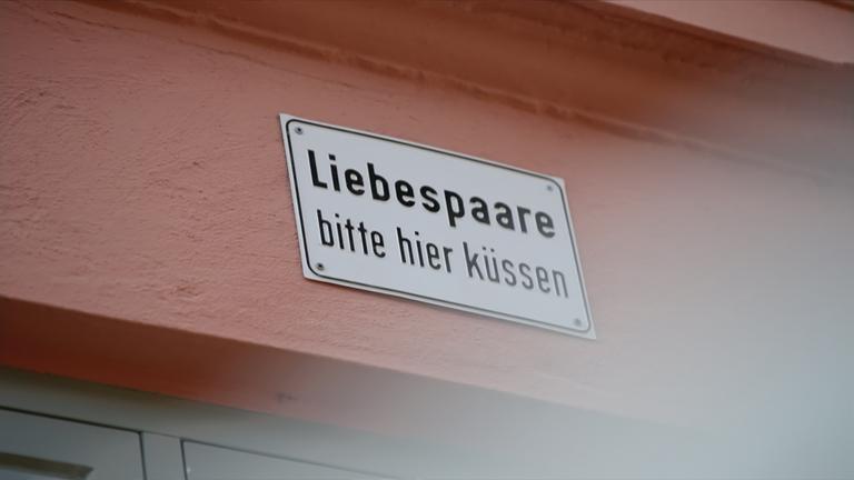 Bitte küssen Schild