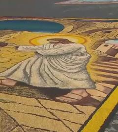 Ein Jesus-Bild gelegt aus bunten Blüten.