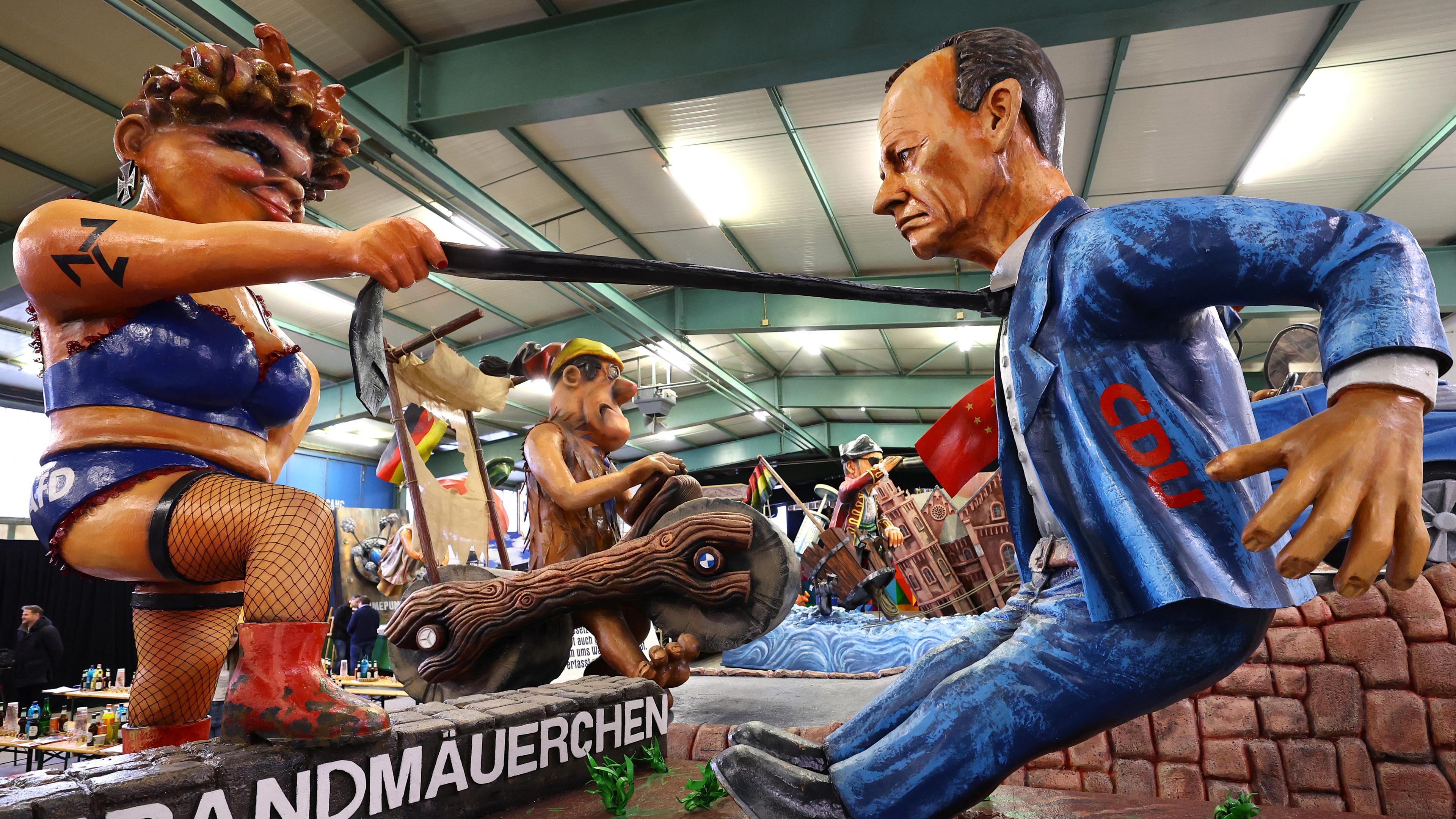 Mainzer Rosenmontag-Wagen: Friedrich Merz vor der Brandmauer nach Rechts