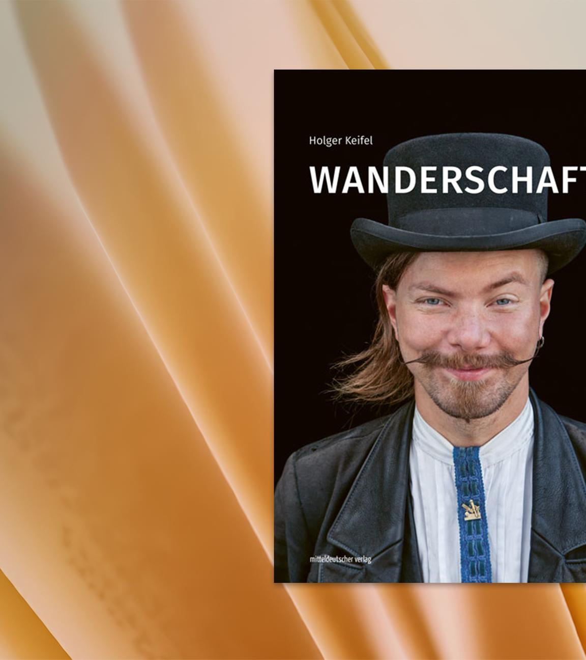 Auf dem Cover des Buches ist ein Mann mit Schnurrbart und Zimmermannstracht zu sehen.