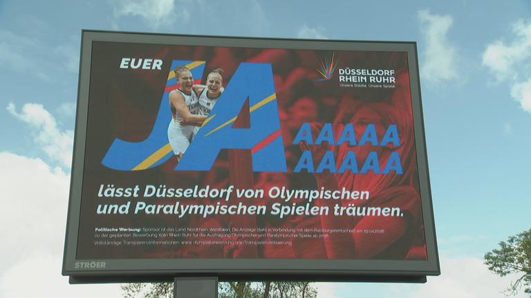 Werbetafel für ein Ja beim Bürgerentscheid zu Olympia