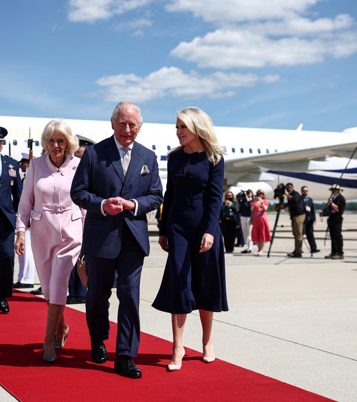 Britain's King Charles III and Britain's Queen Camilla are greeted by US Protocol Chief Monica Crowley as they arrive at Joint Base Andrews, Maryland, on April 27, 2026.