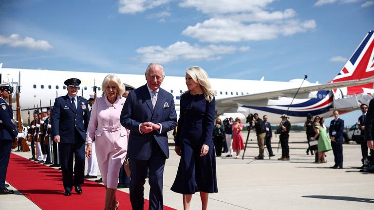 Britain's King Charles III and Britain's Queen Camilla are greeted by US Protocol Chief Monica Crowley as they arrive at Joint Base Andrews, Maryland, on April 27, 2026.
