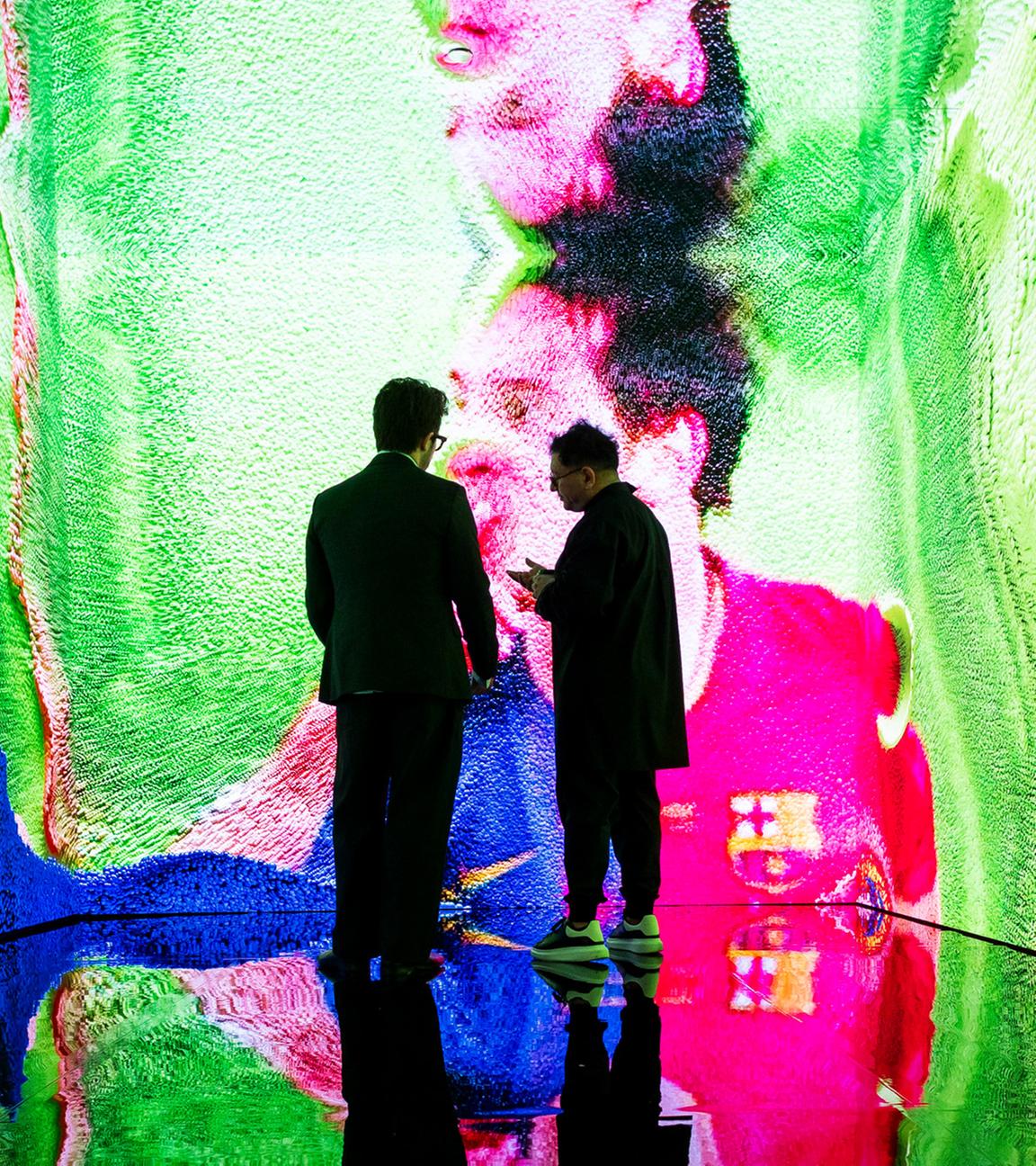  Artist Refik Anadol (R) and Sebastian Sanchez (L), Christies Manager of Digital Art Sales, view the digital artwork installation 'Living Memory: Messi  A Goal in Life' by Anadol during an auction press preview at Christies in New York, New York, USA, 11 July 2025.