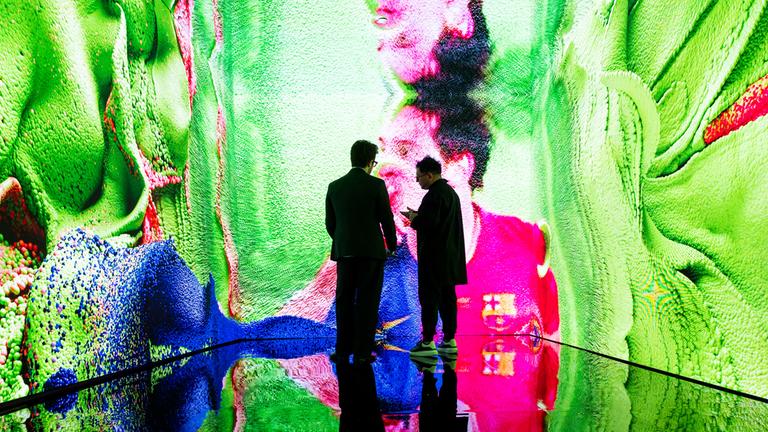  Artist Refik Anadol (R) and Sebastian Sanchez (L), Christies Manager of Digital Art Sales, view the digital artwork installation 'Living Memory: Messi  A Goal in Life' by Anadol during an auction press preview at Christies in New York, New York, USA, 11 July 2025.